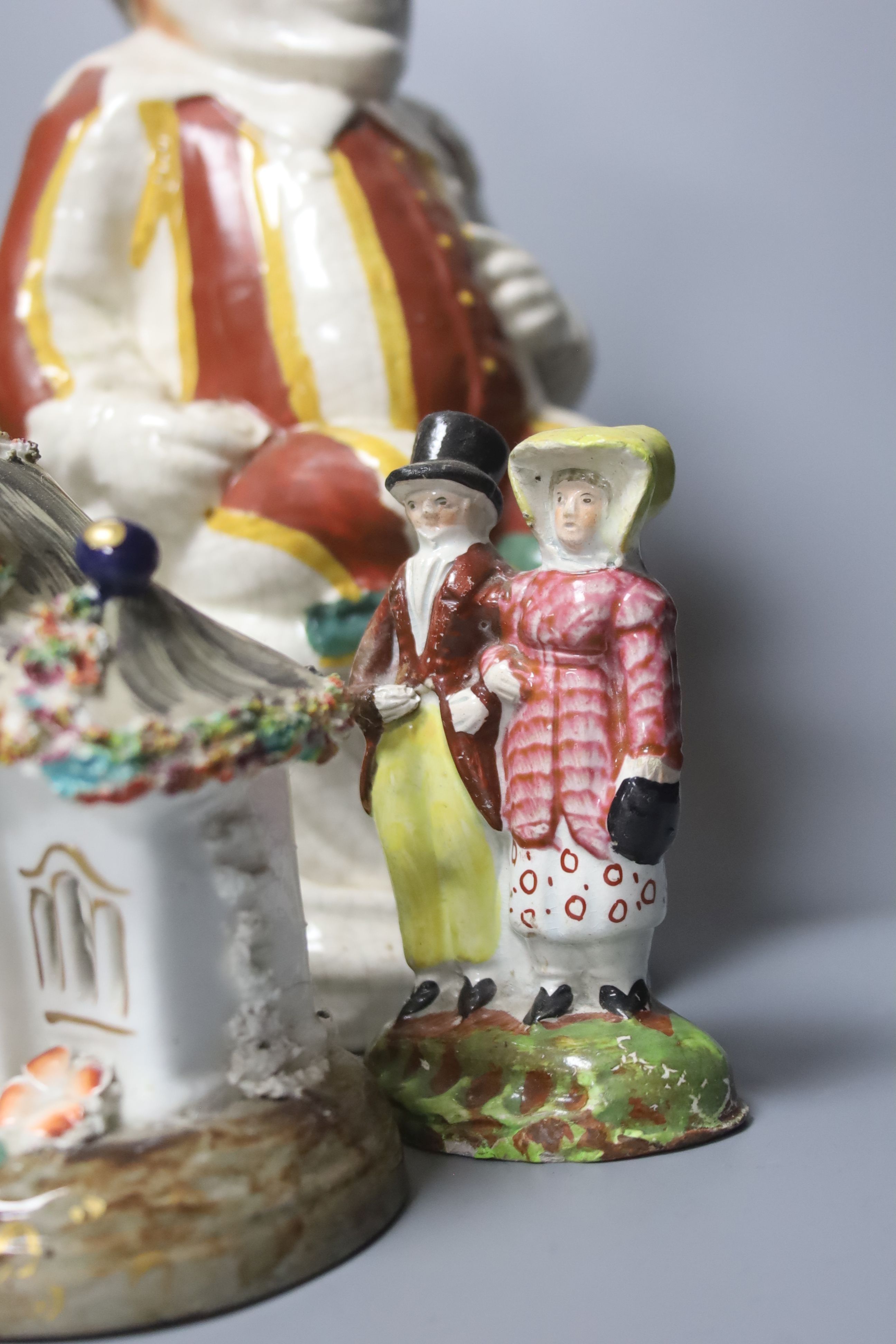A group of assorted 19th century and later Staffordshire ceramics including a Toby jug, Colston Boy and Red Maid Girl Bristol